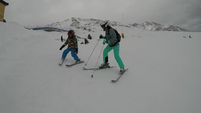 Little boy skiing in the Alps.
Son when skiing. They learn to ski with their parents.

