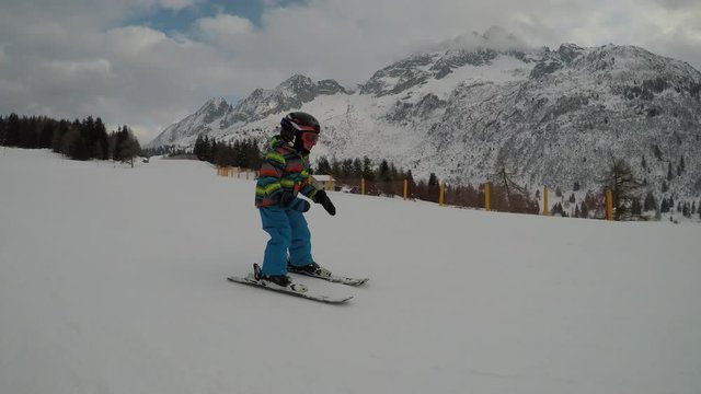 Little boy skiing.
Little boy enjoying skiing. Child learning to ski.