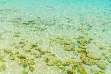 Top view of the sea with the coral reefs at Maldives island .