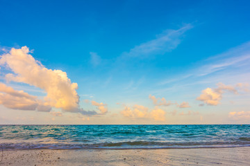 Obraz na płótnie Canvas Beautiful sunrise with sky over calm sea in tropical Maldives island .