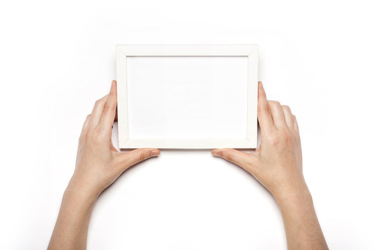 woman hand hold a white photo frame isolated white.