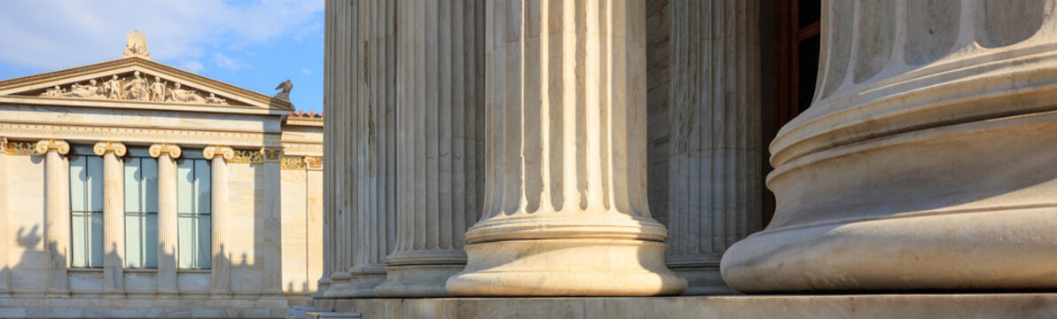 Greek Marble Pillars Infront Of A Classical Building