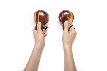 woman hand hold a wood castanets isolated white