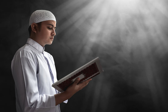 Muslim man reading koran