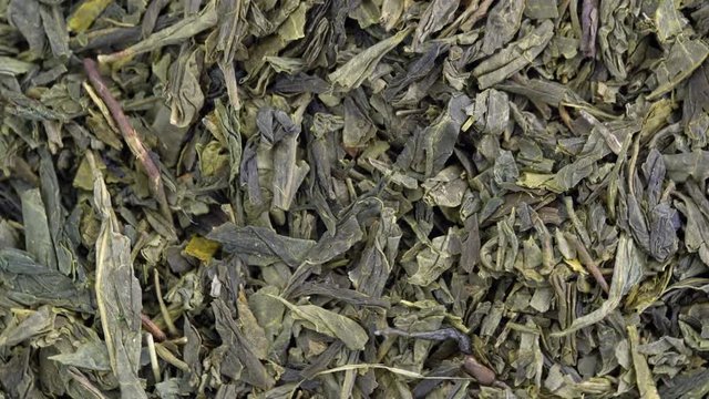 Japanese sencha green tea - macro turning background