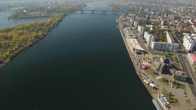 High altitude flight above Krasnoyarsk city and Yenisei river. Fast helicopter drone aerial 4k footage. Russian industrial center.