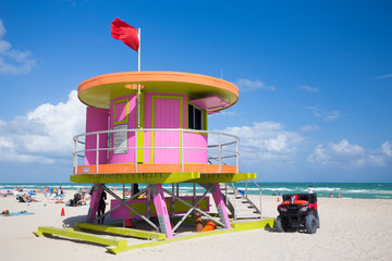 Fototapeta na wymiar USA. FLORIDA. MIAMI BEACH, APRIL,2017: Miami Beach in South Beach with new lifeguard tower and coastline with colorful cloud and blue sky. Florida.