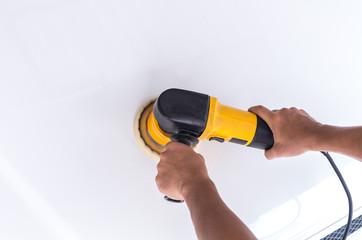 Polishing the white car with reflection, car care concept