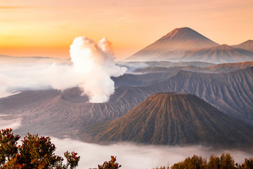 Landscape of Mount Bromo volcano, Batok and Semeru (Mt.) during sunrise from viewpoint on Mount Penanjakan located in Bromo Tengger Semeru National Park, East Java, Indonesia.