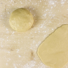 Shortcrust pastry on wooden background - top view