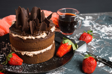 Chocolate cake on the rustic background. Selective focus.