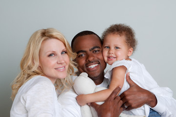 Portrait of happy multicultural family smiling.