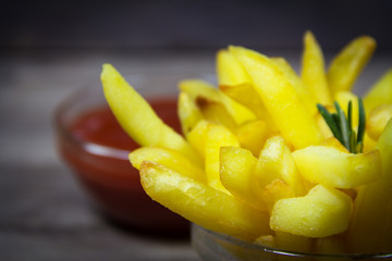 Fototapeta na wymiar Potato with ketchup on wooden background
