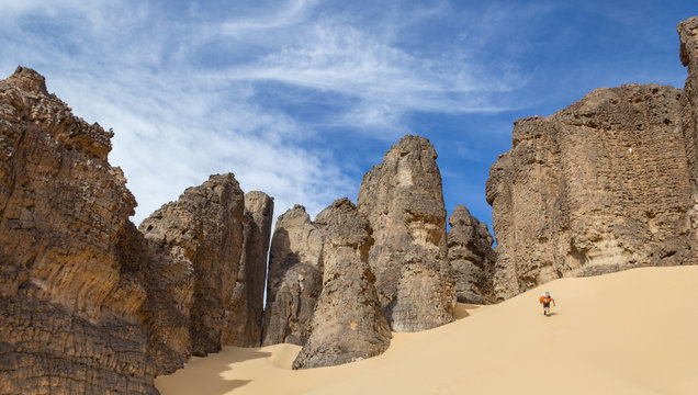 Man walking up the hill in the Hoggar Desert