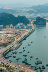 Naklejka premium The dawn view of the Ha Long (Halong) bay. Tourist junks floating among karst limestone rocks South China Sea, Vietnam, Southeast Asia UNESCO World Heritage Site.