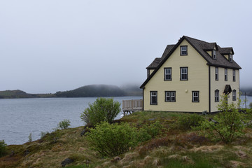 Fototapeta na wymiar Lone house on the bay in Trinity, Newfoundland, Canada