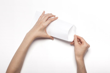 woman hand hold a white envelope isolated white.