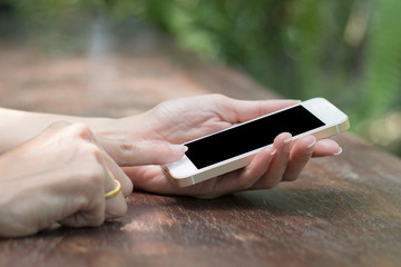 hand using phone blank screen on top view.clipping path inside