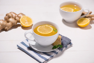 Healthy ginger tea ingredients on a wooden table