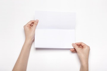 woman hand hold a letter paper isolated white.