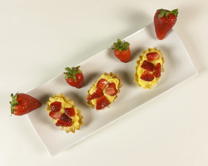 Strawberry pie on white background - top view