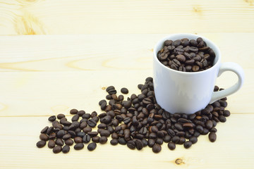 Coffee beans close-up in white cup