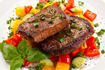 Grilled steaks with vegetables