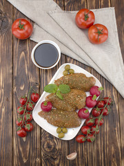 Chicken fillet in marinade on a wooden board. 