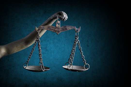 Lady Justice's and holding Scale of Justice isolated on grunge background