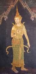 Traditional Thai painting art about Ramayana story on display at the temple wall Wat Prakaew  in Bangkok, Thailand.