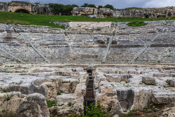 Cavea (ancient auditorium) of Greek theater in Neapolis Archaeological Park in Syracuse, Sicily Island of Italy