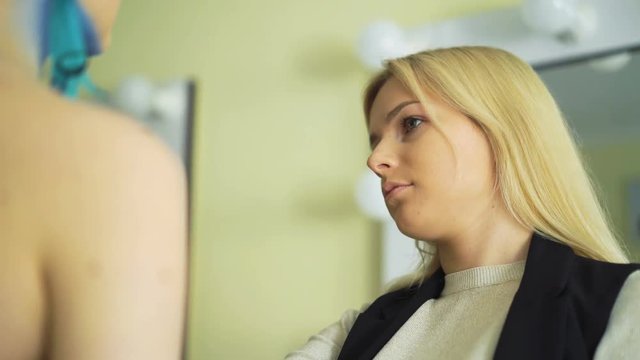 Make-up artist making bodyart makeup for carnival and halloween for girl 4K