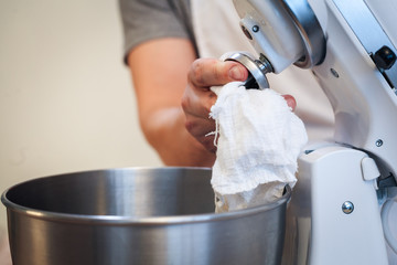The process of washing mixer, Hands wipe with a rag