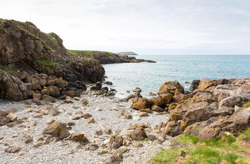 Fototapeta na wymiar Rocky bay close to Cemaes Bay in Anglesey, North Wales