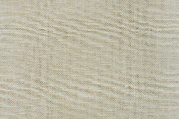 Hessian sackcloth woven texture pattern background in yellow beige cream brown color tone: Eco friendly raw organic flax cloth fabric textile backdrop: Bag rope thread detailed textured burlap canvas