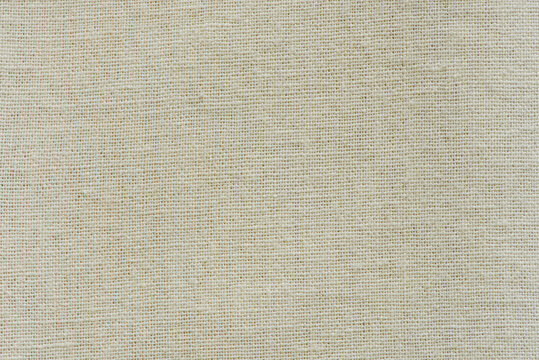 Hessian sackcloth woven texture pattern background in yellow beige cream brown color tone: Eco friendly raw organic flax cloth fabric textile backdrop: Bag rope thread detailed textured burlap canvas