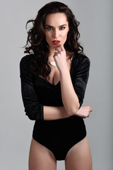 Fototapeta premium Attractive girl, model of fashion, wearing black lingerie.