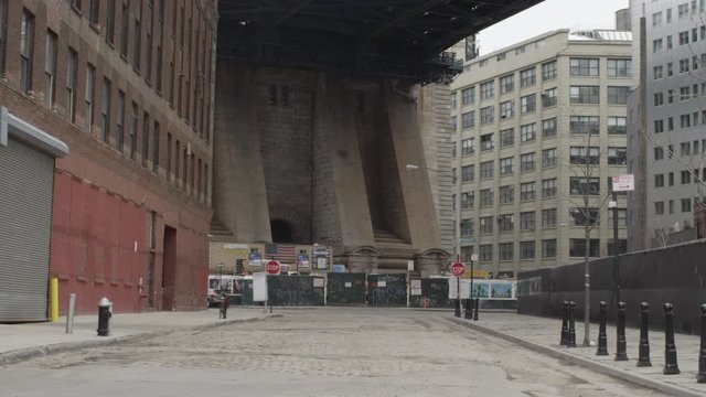 Empty street under bridge in New York