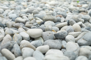 Fototapeta na wymiar Rock garden, white pebble, rock pile texture. background, road surface