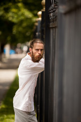 Fashion hipster posing outside in the city. Style and diversity