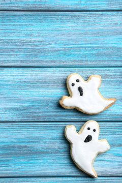Fresh halloween gingerbread cookies on blue wooden table