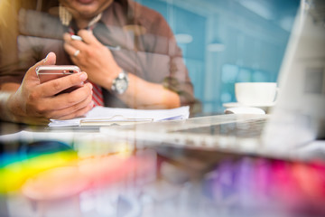 Businessman making presentation on office table with smart phone and laptop computer and graph business with social network diagram and business strategy digital