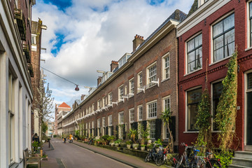 Obraz premium Amsterdam, The Netherlands, April 22, 2017: Old Monastery Karthuizerhof at the Karthuizerstraat in the Jordaan in Amsterdam