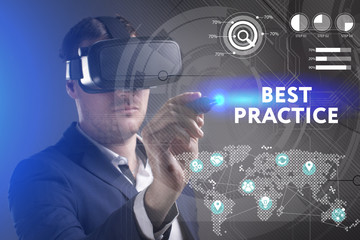 Business, Technology, Internet and network concept. Young businessman working in virtual reality glasses sees the inscription: Best practice