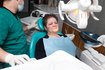 The dentist works with the client in the clinic