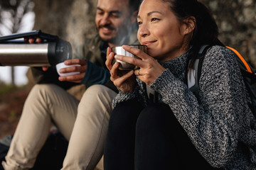 Young couple taking a break on a hike