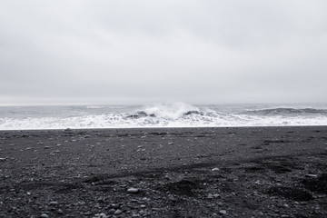 Waves in the beautiful volcanic black sand beach in Dyrholaey near Vik, Iceland.  