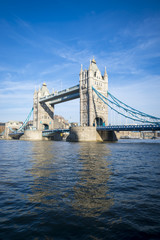Bright scenic view of Tower Bridge standing in blue sky above the River Thames in London, UK