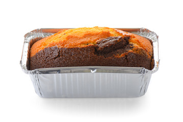 Chocolate cake in foil oval box isolated on white background