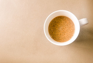 A cup of hot coffee and chia seed.